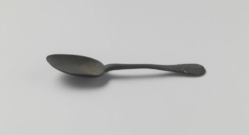 Tin spoon with spatula-shaped handle