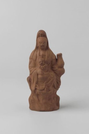 Woman with child on knee of red stoneware