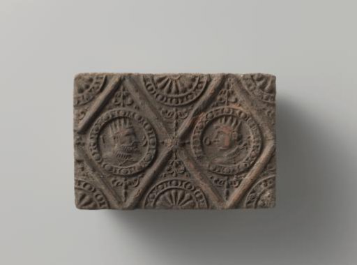 Fireplace with two crowned medallion figures in a diamond shape