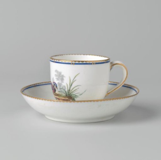 Cup and saucer with birds in a landscape