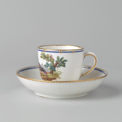 Cup and saucer with birds in a landscape