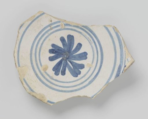 Fragment of a plate of earthenware decorated with a star in circles