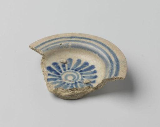 Earthenware dish decorated with blue geometric ornaments
