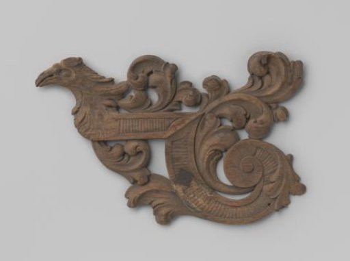 Oak wood carving with ornaments and a bird's head