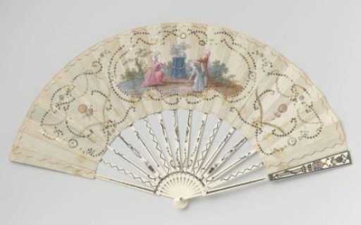Folding fan with leaf of silk, on which in gouache a group at a love altar with burning heart and turtledoves and on both sides the balloon of the Montgolfier brothers surrounded by metallic sequins, on a mount of bone inlaid with 'métal en quatre couleurs'