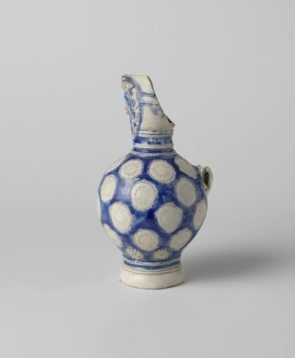 Fragment of a jug with a lion's head and medallions