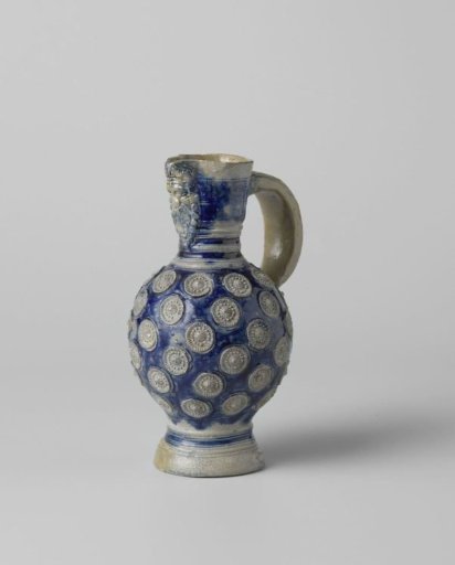 Jug with a mask and medallions