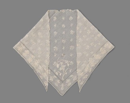 Fichu, triangular, of linen batiste embroidered with a floral scatter motif of chain stitches and edged with open hems between which runs a leaf and flower garland of chain stitches