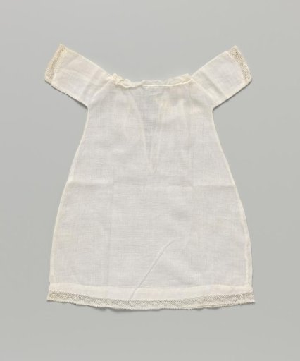 Shirt with short sleeves and lace along the neck, sleeves, and hem