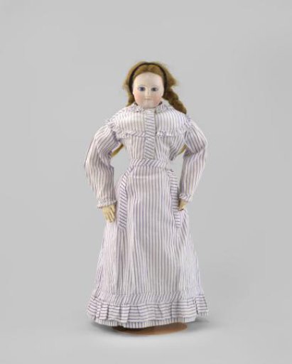 Doll of white glacé with a porcelain head and blue eyes. Real blonde hair.