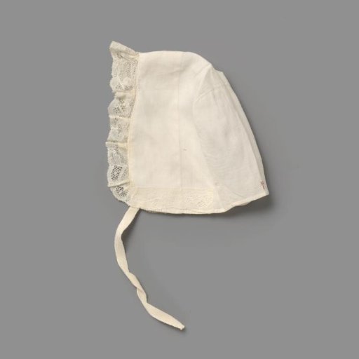 Children's cap of white cotton (?) trimmed with lace and numbered in red cross-stitch with H8; two ribbon ties