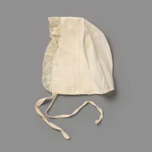 Children's cap of white cotton (?) trimmed with lace and numbered in red cross-stitch with H8; one ribbon tie
