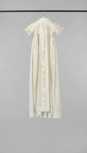 White baptismal gown with short sleeves trimmed with strips of Valenciennes lace