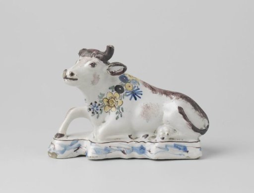 Cow, lying down, multicolored painted.