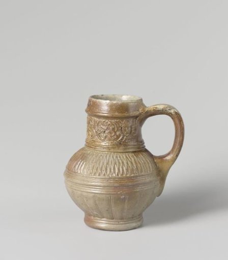 Jug with chip carving and masks