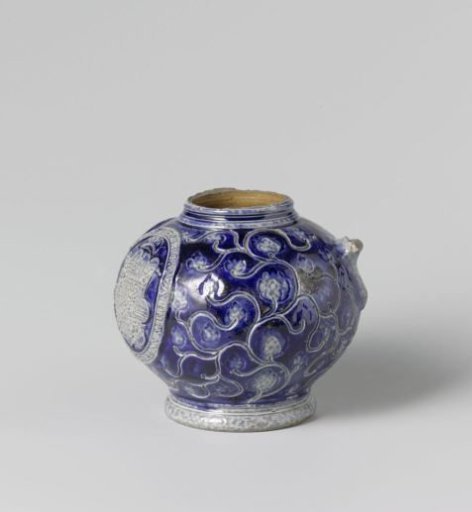 Fragment of a jug with the coat of arms of Spain among floral scrolls