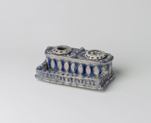 Ink stand with circles and a flower roundel