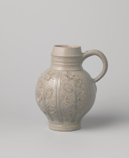 Jug with flowering plants