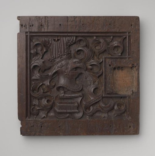 Door of a cabinet with a coat of arms featuring a crowned visor helmet in the shape of an eagle's head