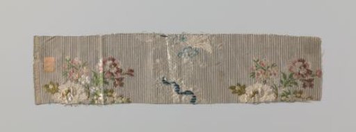 Fragment of striped silk fabric with flowers and lace braid