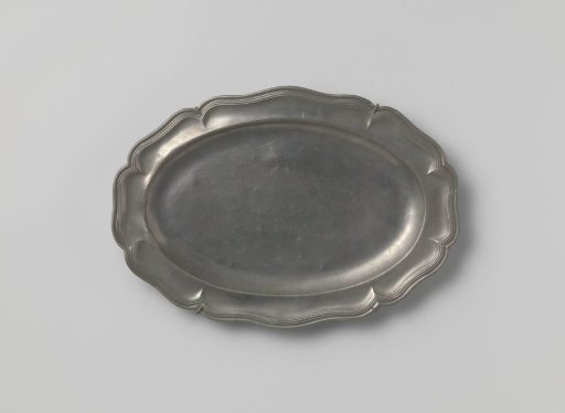Oval plate with carved edge