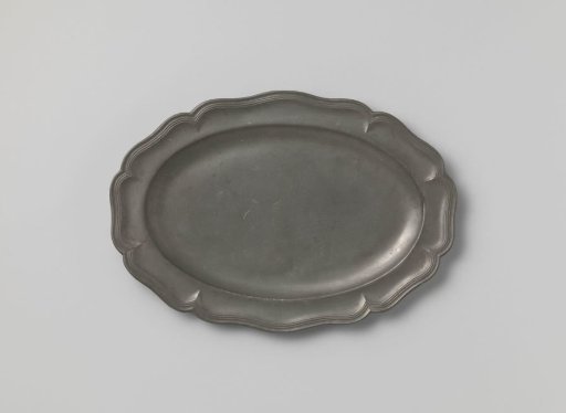 Oval dish with a carved rim