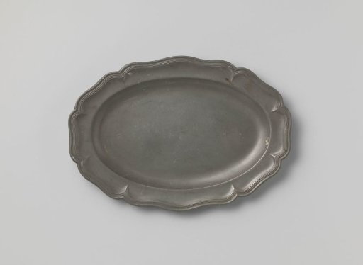 Oval dish with a carved rim