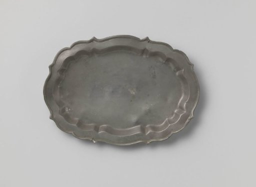 Oval dish with a carved rim