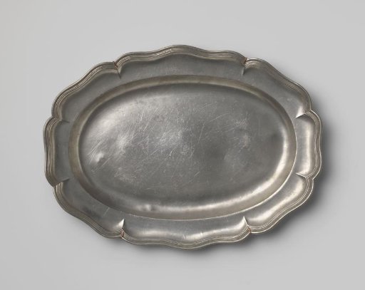 Oval dish with a carved rim