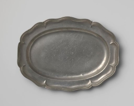 Oval dish with carved rim