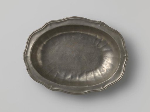 Oval dish with carved rim