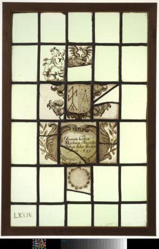 Window with coat of arms featuring a compass and inscription "Johannes Cohus Stridiorus ... Lector theologia Anno 1699"