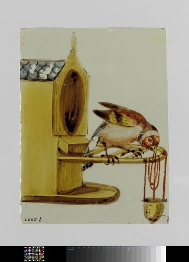 Pane with a sparrow at a birdhouse with a feeder