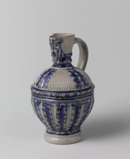 Jug with a mask, chip carving and fluting