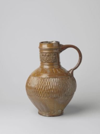 Jug with foliate scrolls, masks and chip carving