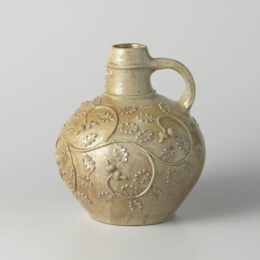 Bearded man jug with floral decoration
