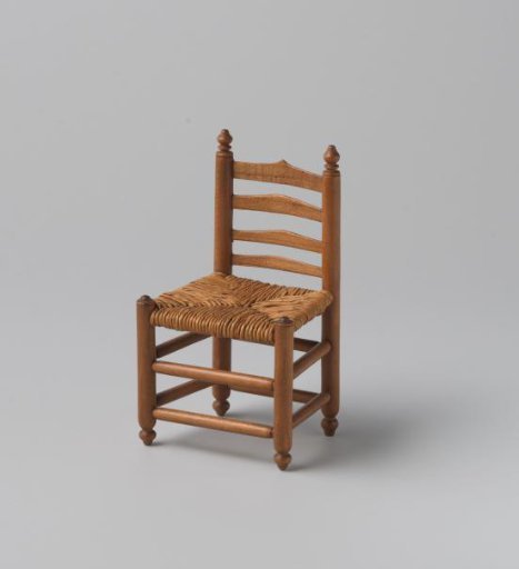 Knob chair with seat of woven reed