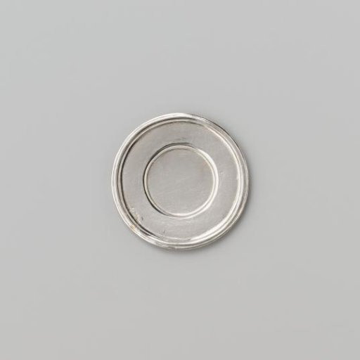 Silver-coloured small plate with broad flat profiled rim.