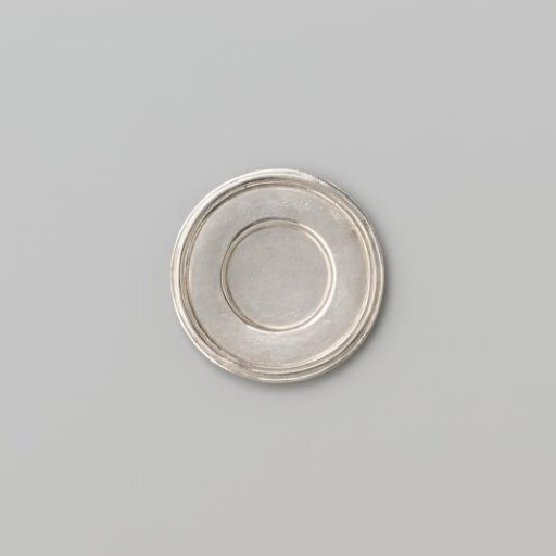 Silver-coloured small plate with broad flat profiled rim.
