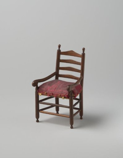 Armchair (knob chair model) of walnut wood with smooth, turned stiles and cross rails, front legs and back stiles ending in finely turned knobs