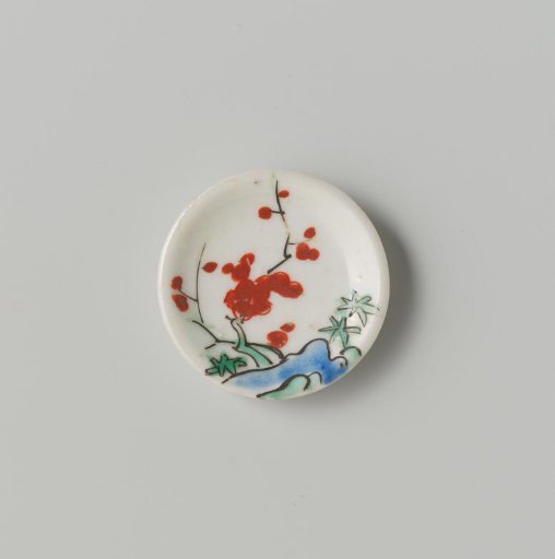 Porcelain dish with polychrome decoration in Kakiemon style (flowering branches and rock)
