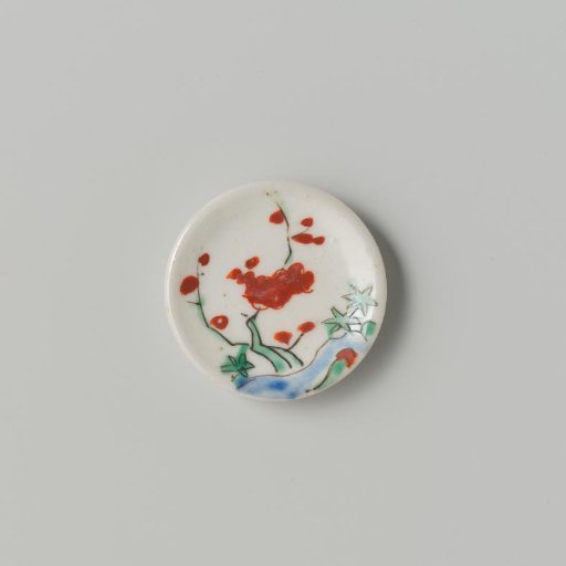 Porcelain dish with polychrome decoration in Kakiemon style (flowering branches and rock)