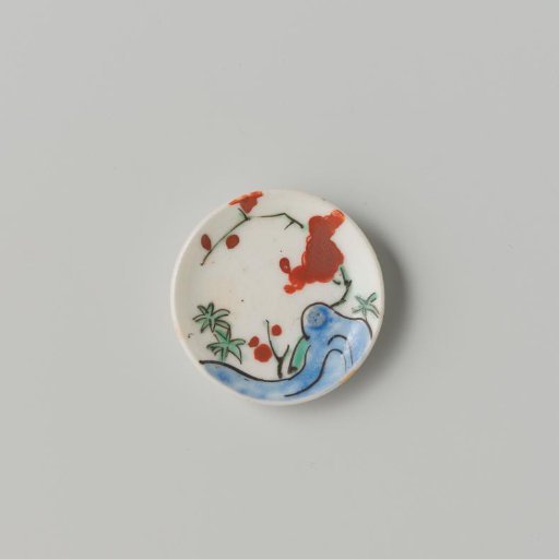 Porcelain dish with polychrome decoration in Kakiemon style (flowering branches and rock)
