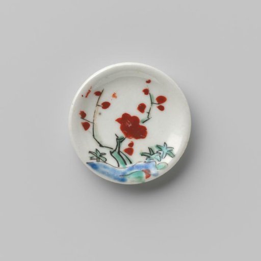 Porcelain dish with polychrome decoration in Kakiemon style (flowering branches and rock)