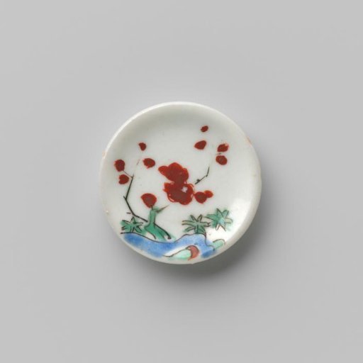 Porcelain dish with polychrome decoration in Kakiemon style (flowering branches and rock)