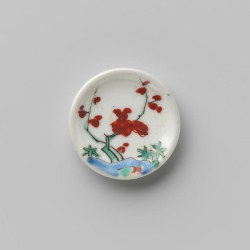 Porcelain dish with polychrome decoration in Kakiemon style (flowering branches and rock)