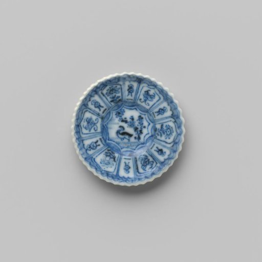 Porcelain plate with blue underglaze decoration in 'Kraak' Wanli style; flat with bird (duck) under tree on shore, also decorated on the reverse
