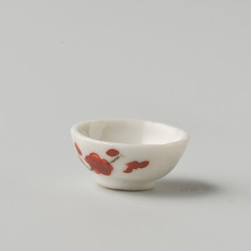 Porcelain bowl with polychrome decoration in Kakiemon style, flowering branch on the outside of the bowl