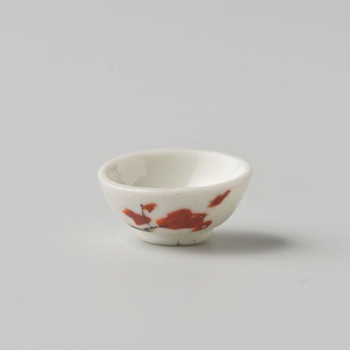 Porcelain bowl with polychrome decoration in Kakiemon style, flowering branch on the outside of the bowl