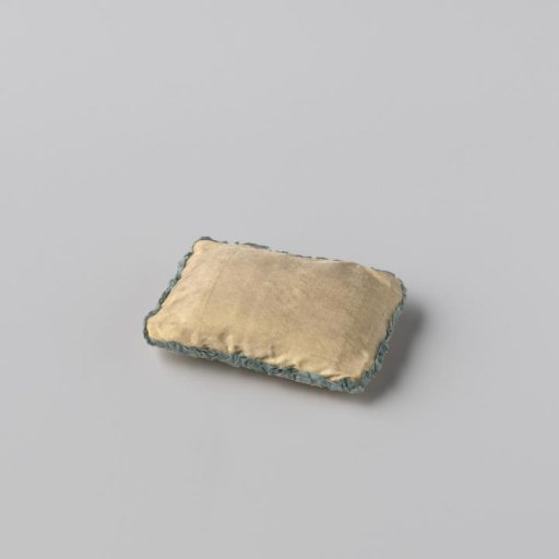 Rectangular cushion made of light yellow silk